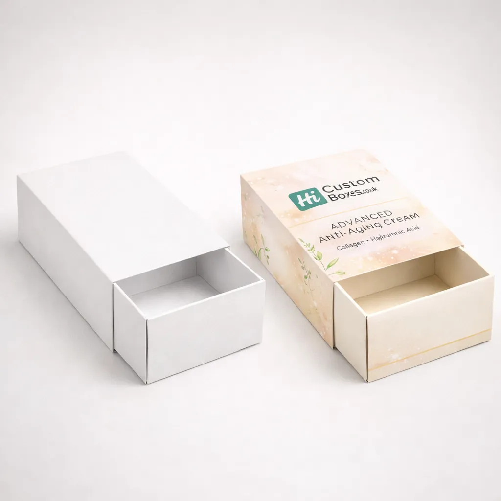 Two drawer-style slide boxes, one minimal white and one decorated with soft floral patterns and logos. class=
